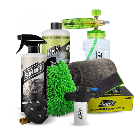 Collection of car care products including bottles, sprays, and cloths on a white background