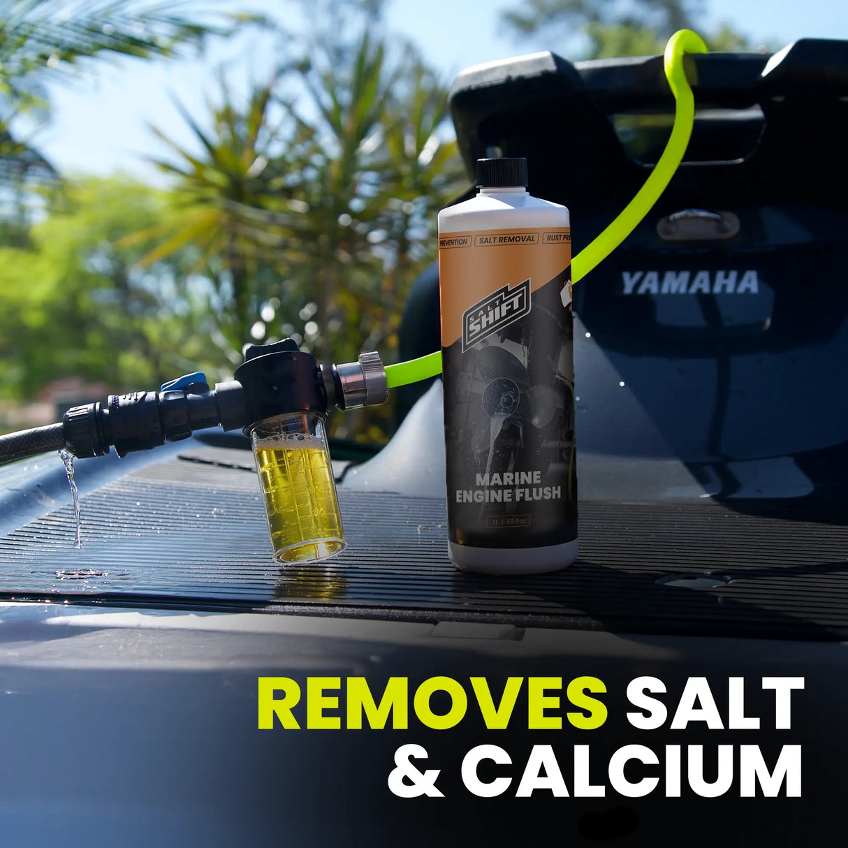 Marine engine flush bottle on a Yamaha boat with cleaning solution being applied.