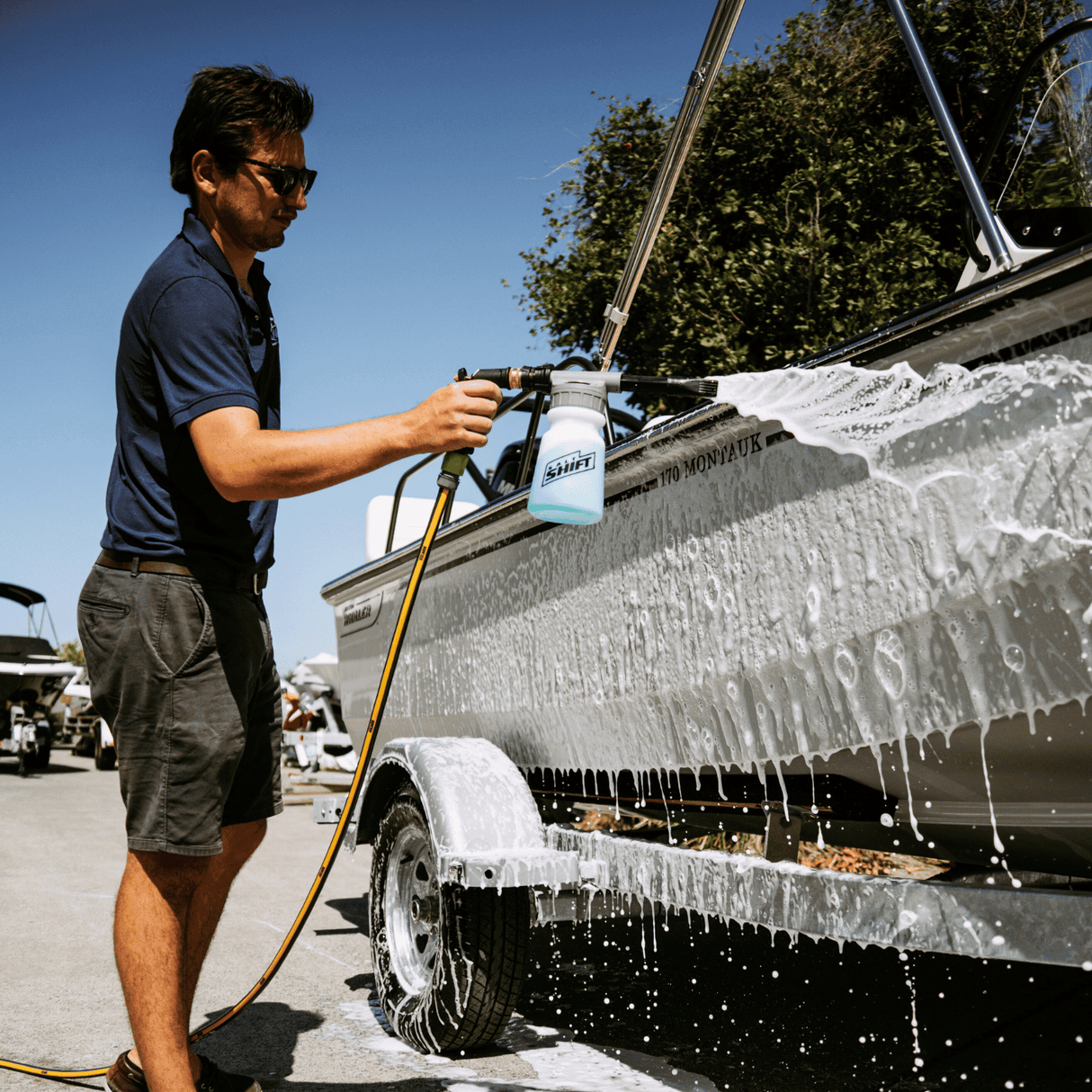 Men cleaning boat with salt shift product
