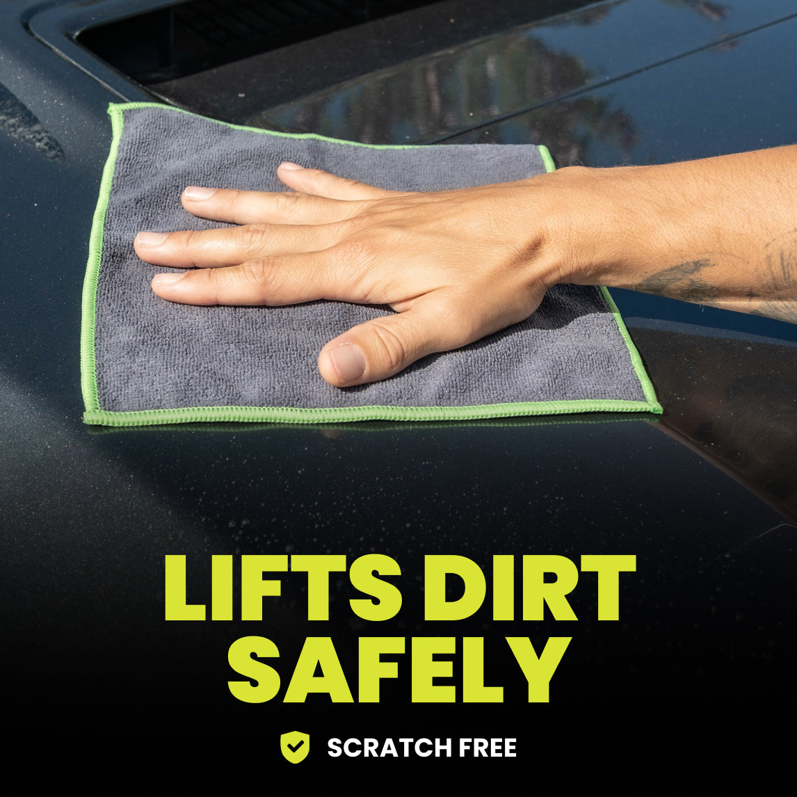 Hand using a microfiber cloth to clean a car surface with text 'Lifts Dirt Safely' and 'Scratch Free'.
