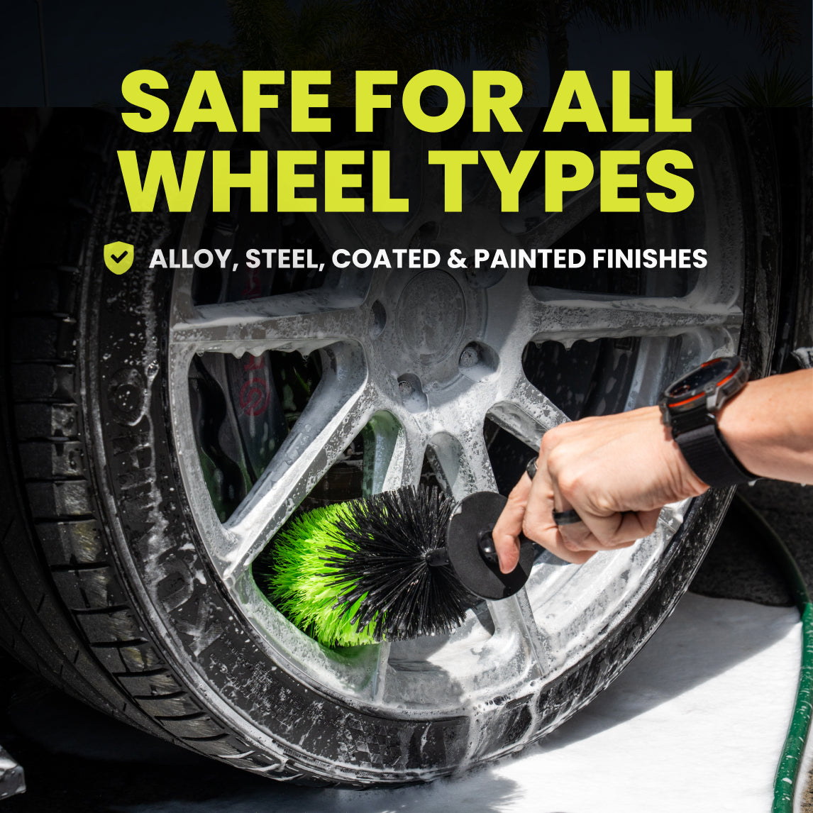 Person cleaning a car wheel with a brush, text indicating safety for all wheel types.