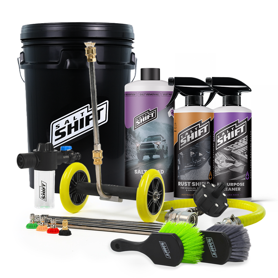 Automotive cleaning tools and products including a pressure washer, bottles, and brushes on a white background.