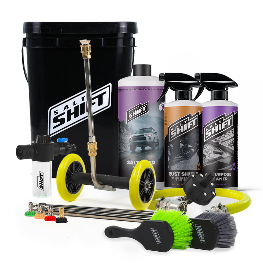 Automotive cleaning tools and products including a pressure washer, bottles, and brushes on a white background.