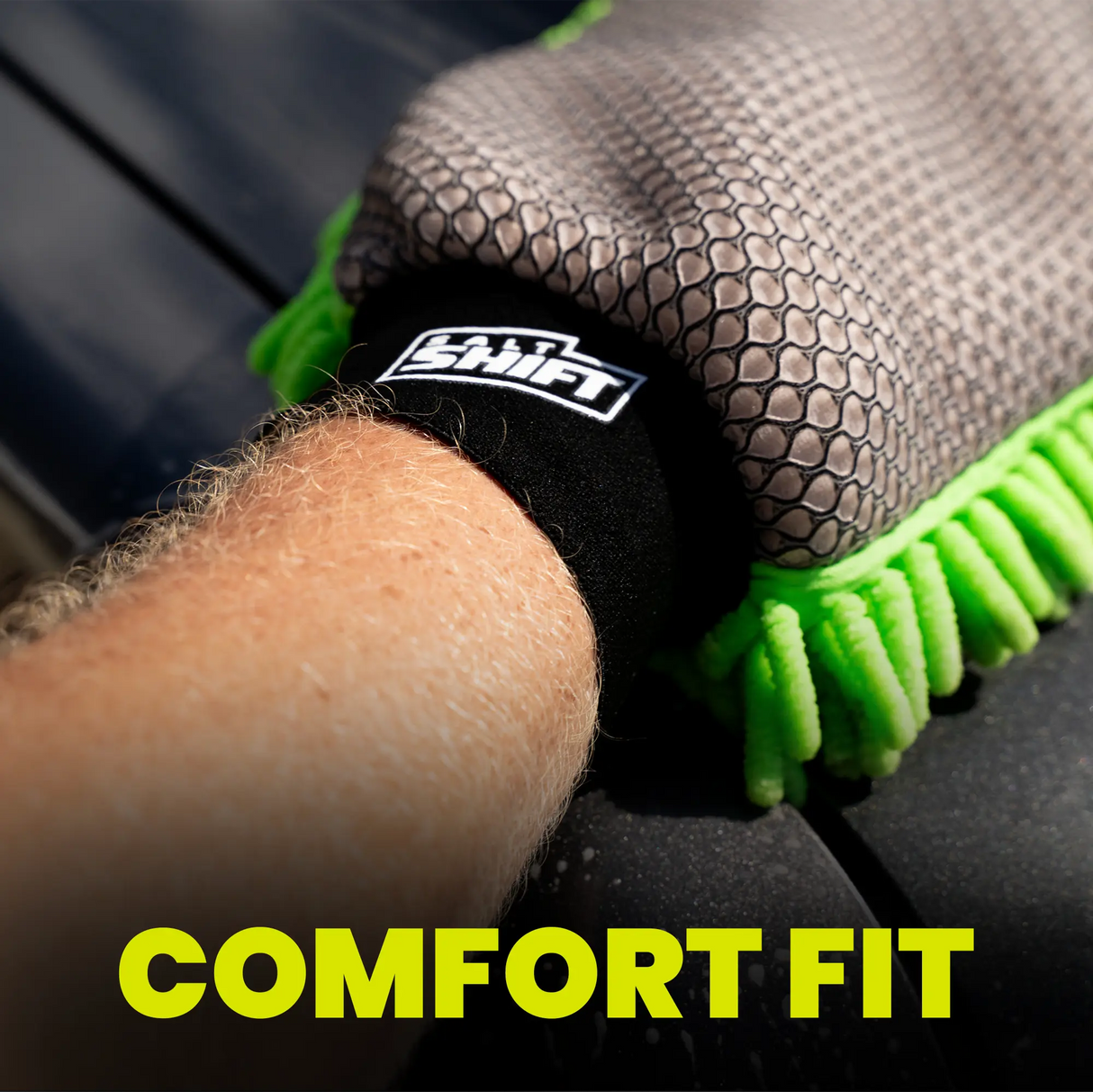 Person wearing a black and green cleaning glove with 'Swift' branding, focusing on comfort fit.