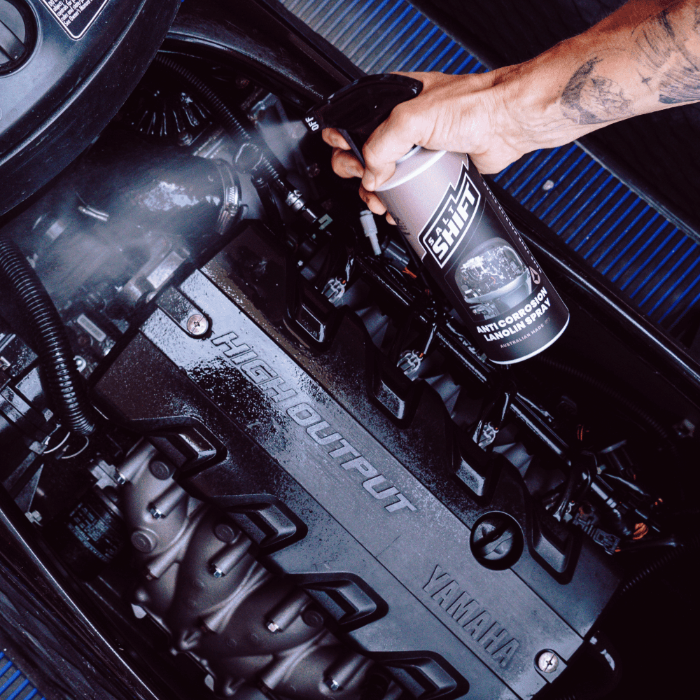 Salt Shift Anti-Corrosion Lanolin Spray being sprayed on boat engine