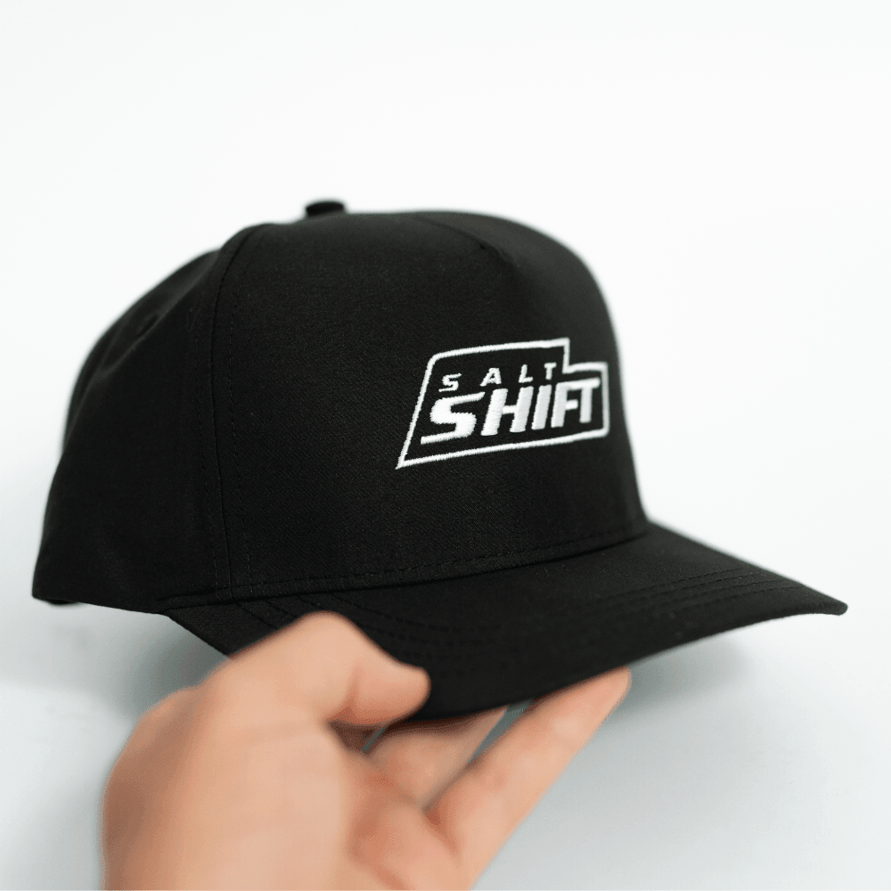 Salt Shift Merch Cap being hold