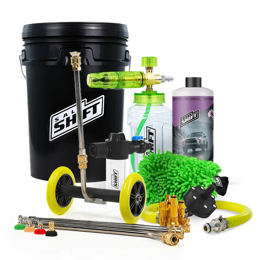 Car cleaning kit with various tools and bottles on a white background