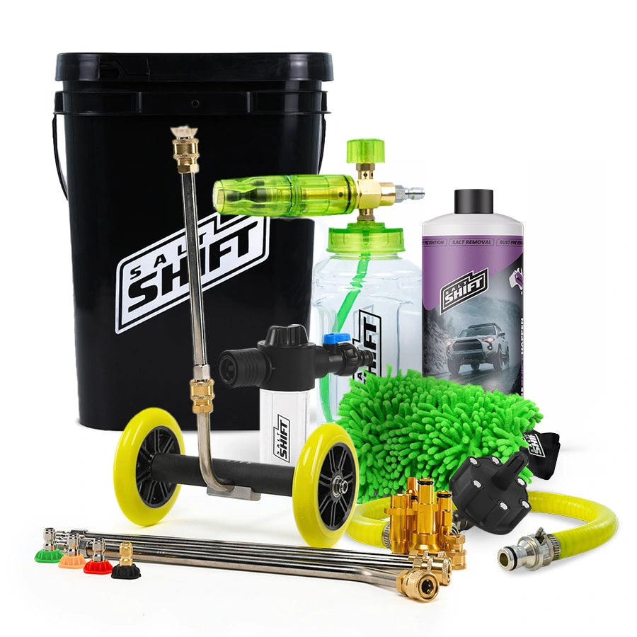 Car cleaning kit with various tools and bottles on a white background