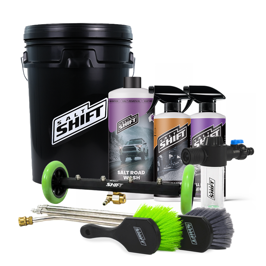 Car care product set with bottles, nozzles, and brushes on a white background