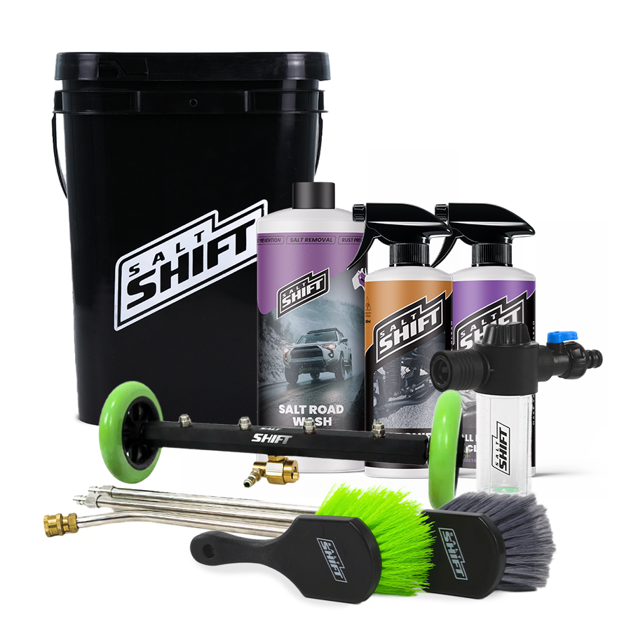 Car care product set with bottles, nozzles, and brushes on a white background