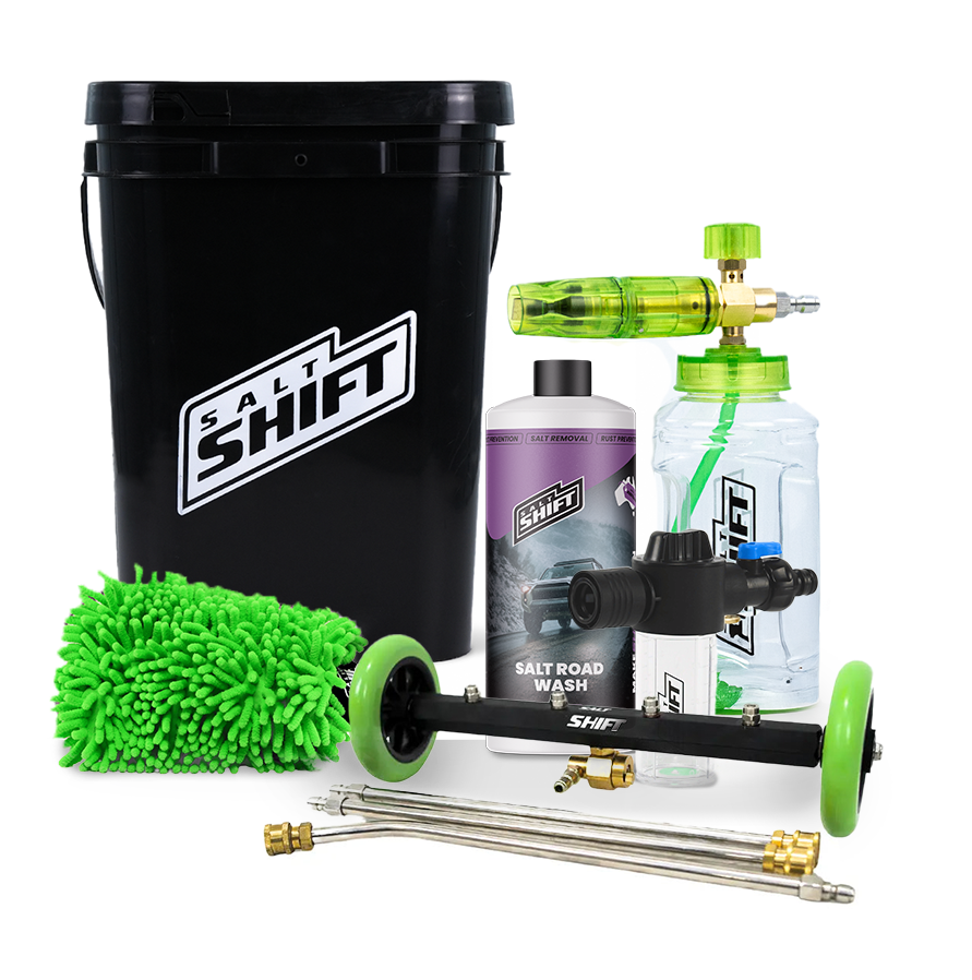 Car cleaning kit with black bucket, bottles, and cleaning tools on a white background