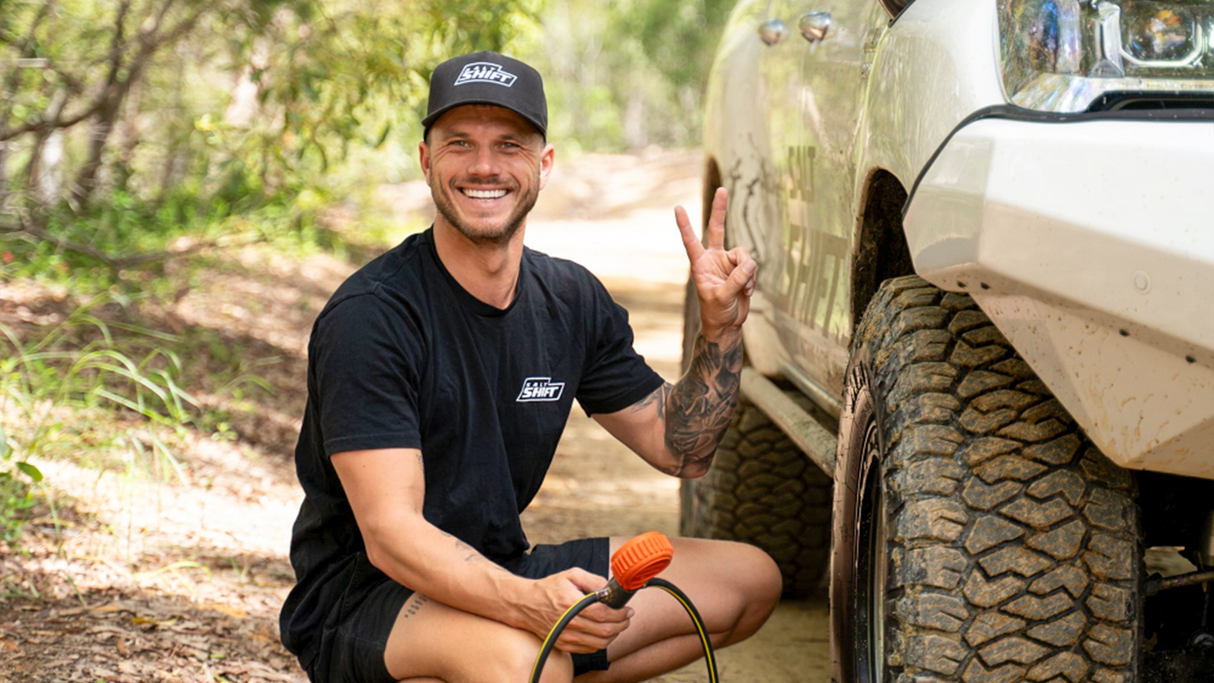 mike, the director, wearing Salt Shift Trucker Cap. his next to his 4x4