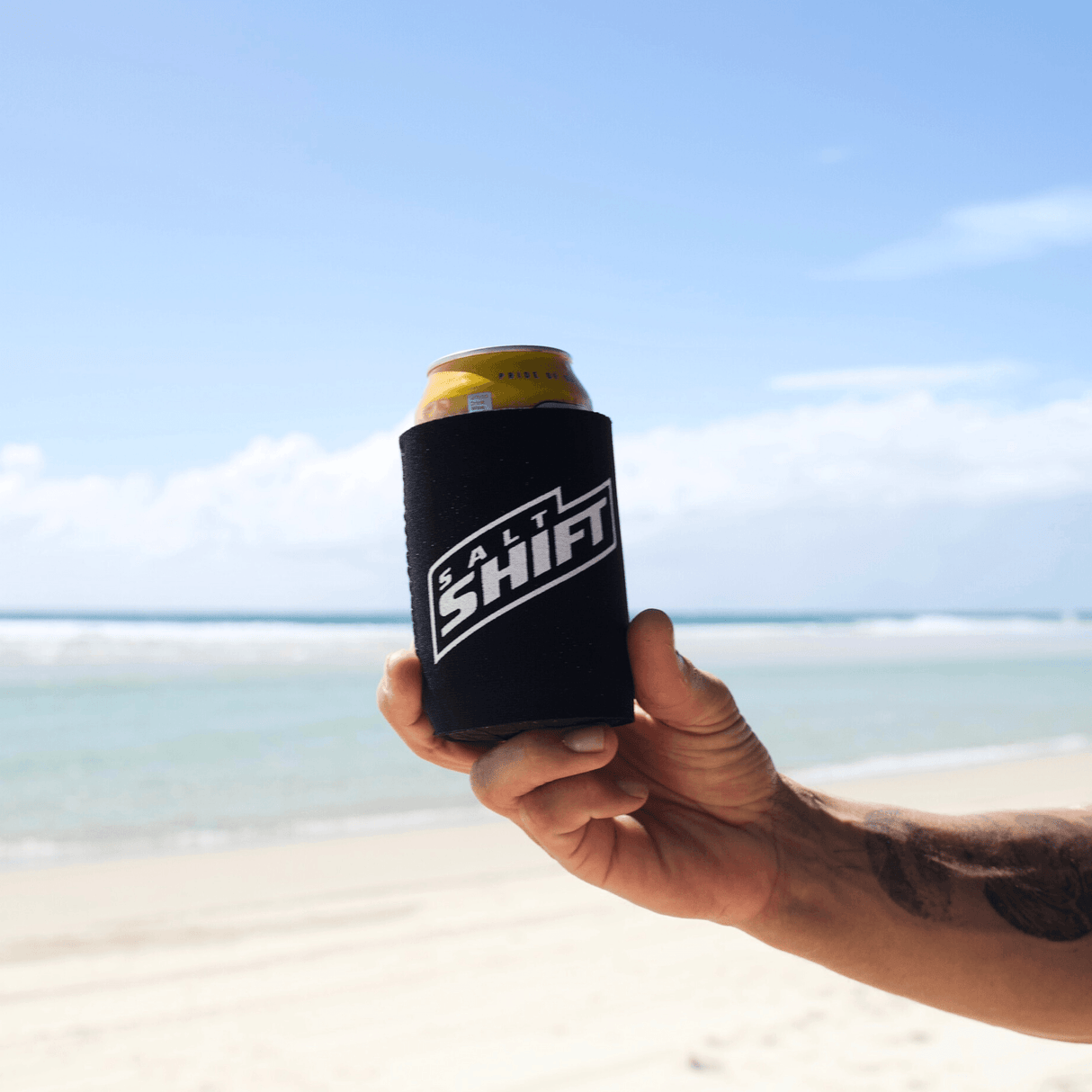 Salt Shift Suby Cooler being hold on a beach