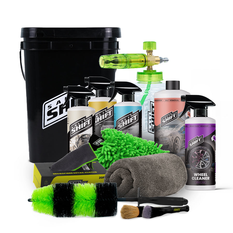 Collection of car care products including bottles, sprays, and cleaning tools on a white background