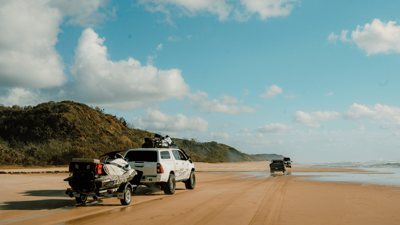 4WD driving on the sand by the beach