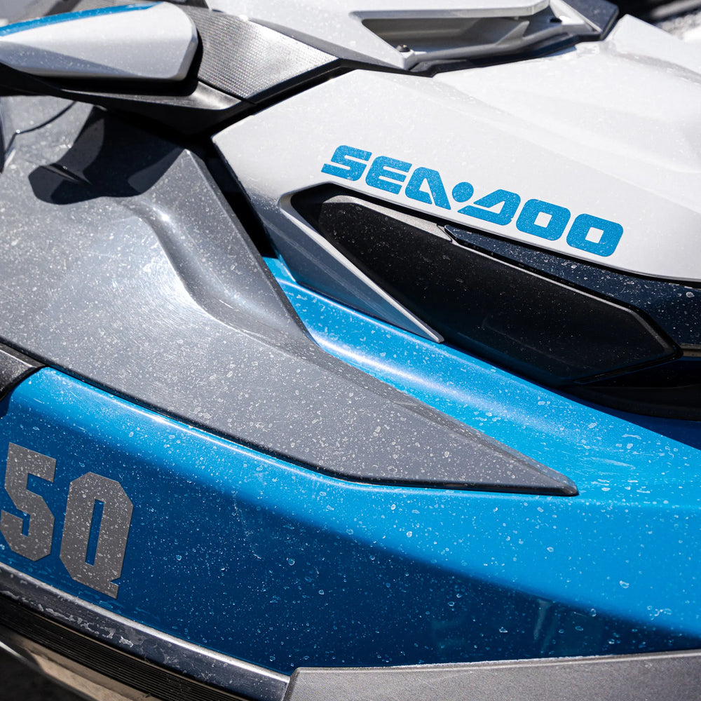 Close-up of a Sea-Doo watercraft with '50' branding on a blue and gray background.