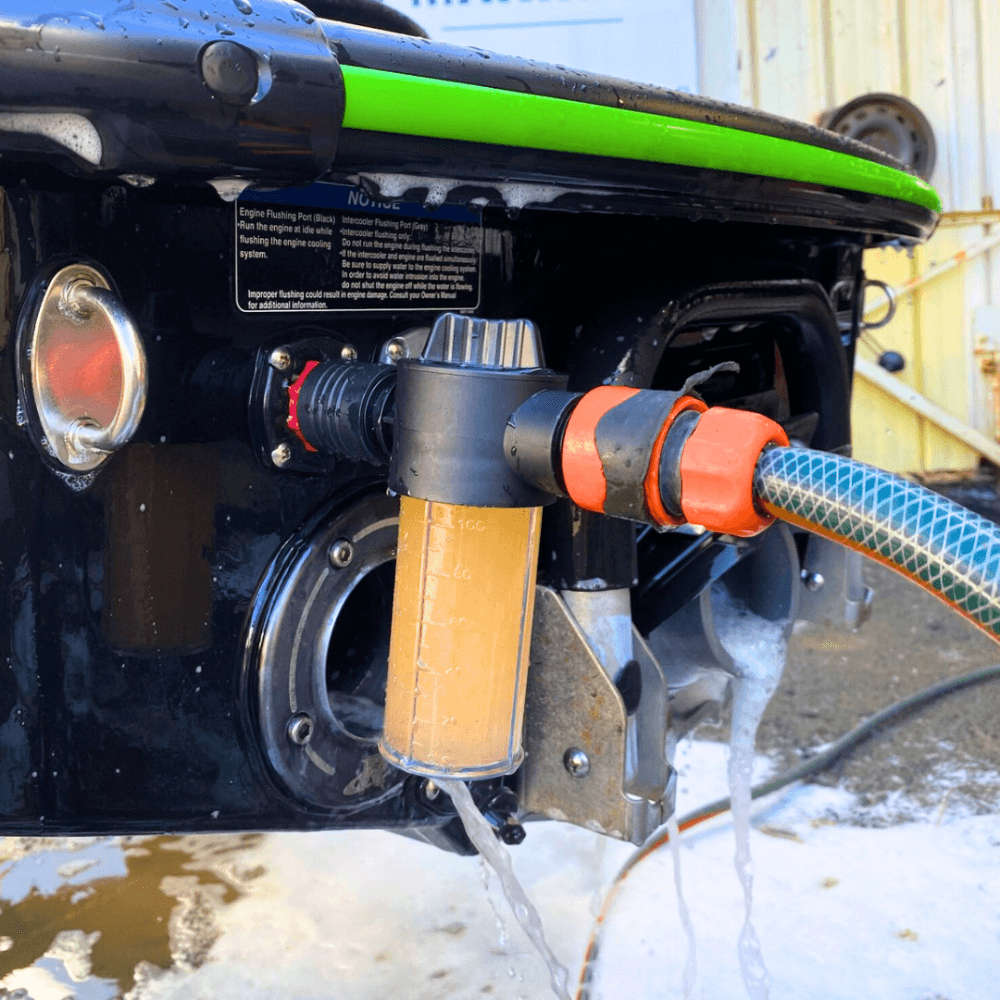 A Salt Shift engine flush system connected to a jetski motor for cleaning.
