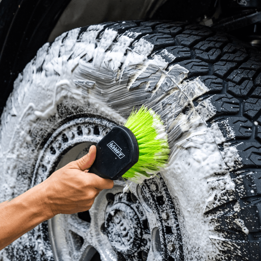 Salt Shift Soft Hard Brush Combo washing a car tyre