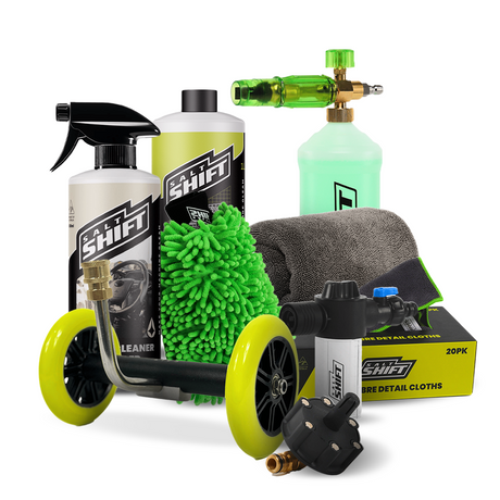 Collection of cleaning tools including bottles, nozzles, and a scrubber on a white background