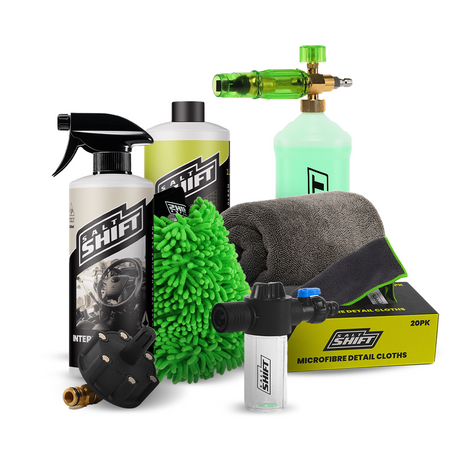 Collection of car care products including bottles, sprays, and cloths on a white background