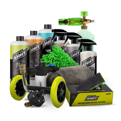 Automotive detailing products including bottles, a spray gun, and cloths on a white background.