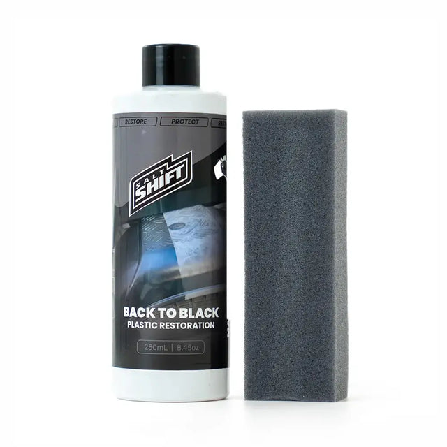 Bottle of 'Back to Black' plastic restoration product with a black sponge on a white background