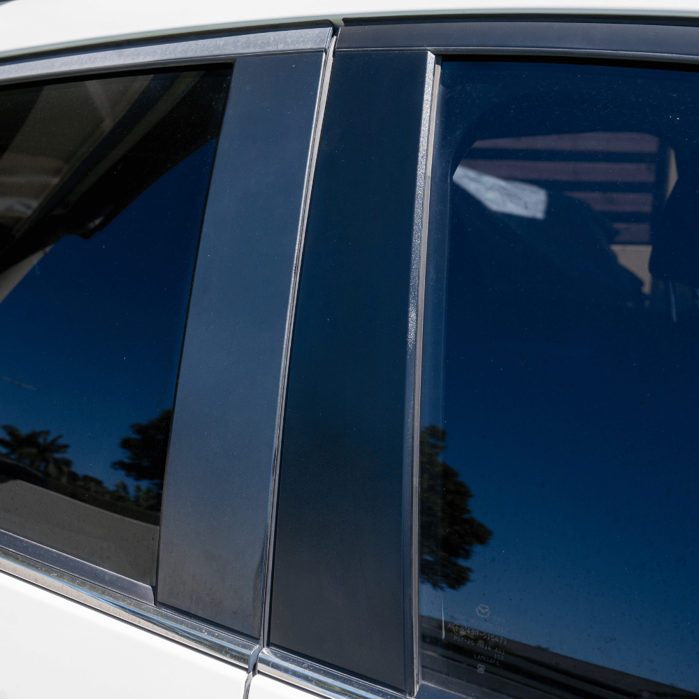 Close-up of a car window with a reflective surface