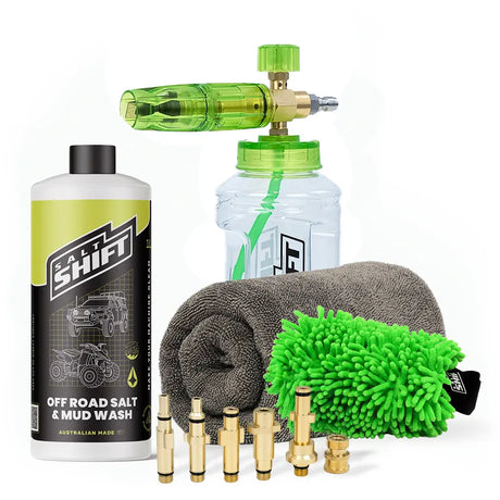 Car cleaning kit with a bottle, spray gun, microfiber cloths, and nozzles on a white background.