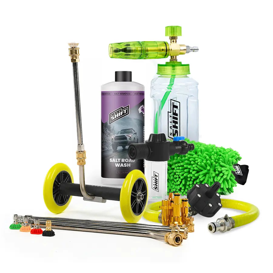 Car cleaning kit with various tools and bottles on a white background