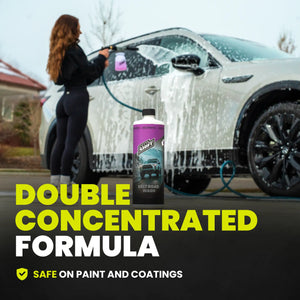 Person washing a car with a bottle of car wash product labeled 'Double Concentrated Formula' and 'Safe on Paint and Coatings'.