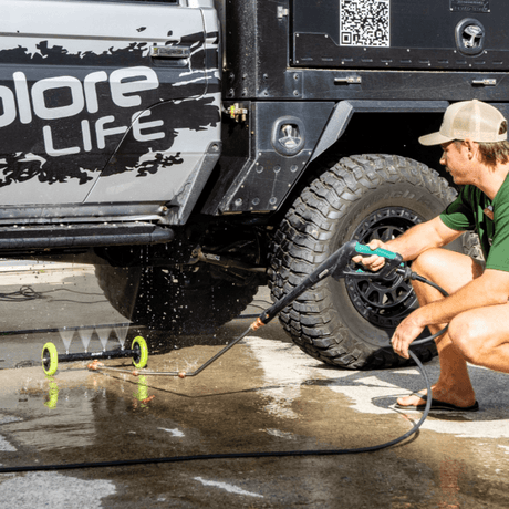Men cleaning a car undercarriage with Salt Shit Underbody Blaster Kit