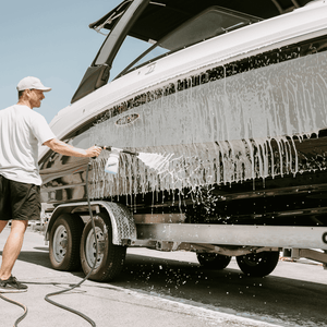 men cleaning boat with salt shift product 