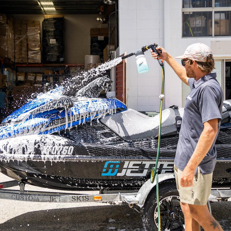 Jetski covered in light foam wash, breaking down salt for a deep clean.