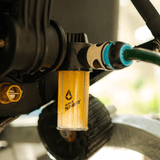 A Salt Shift engine flush system connected to a boat motor for cleaning.