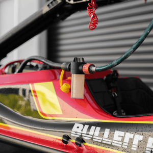 A Salt Shift engine flush system connected to a jetski motor for cleaning.