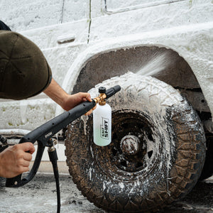 4x4 covered in thick foam wash, breaking down dirt and grime for a deep clean.