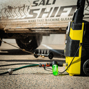 A Salt Shift underbody washer in action, blasting dirt off a 4x4 chassis.